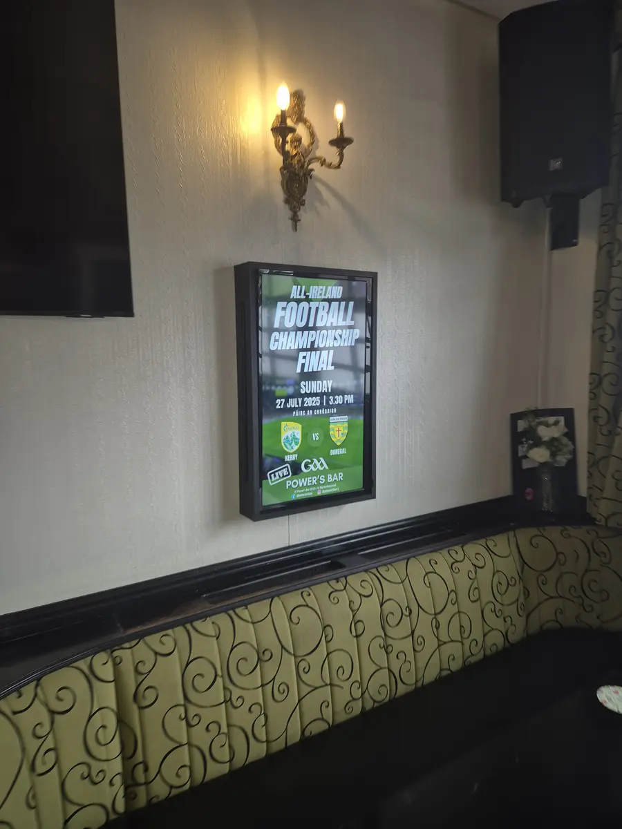 Digital signage screen in a UK pub.