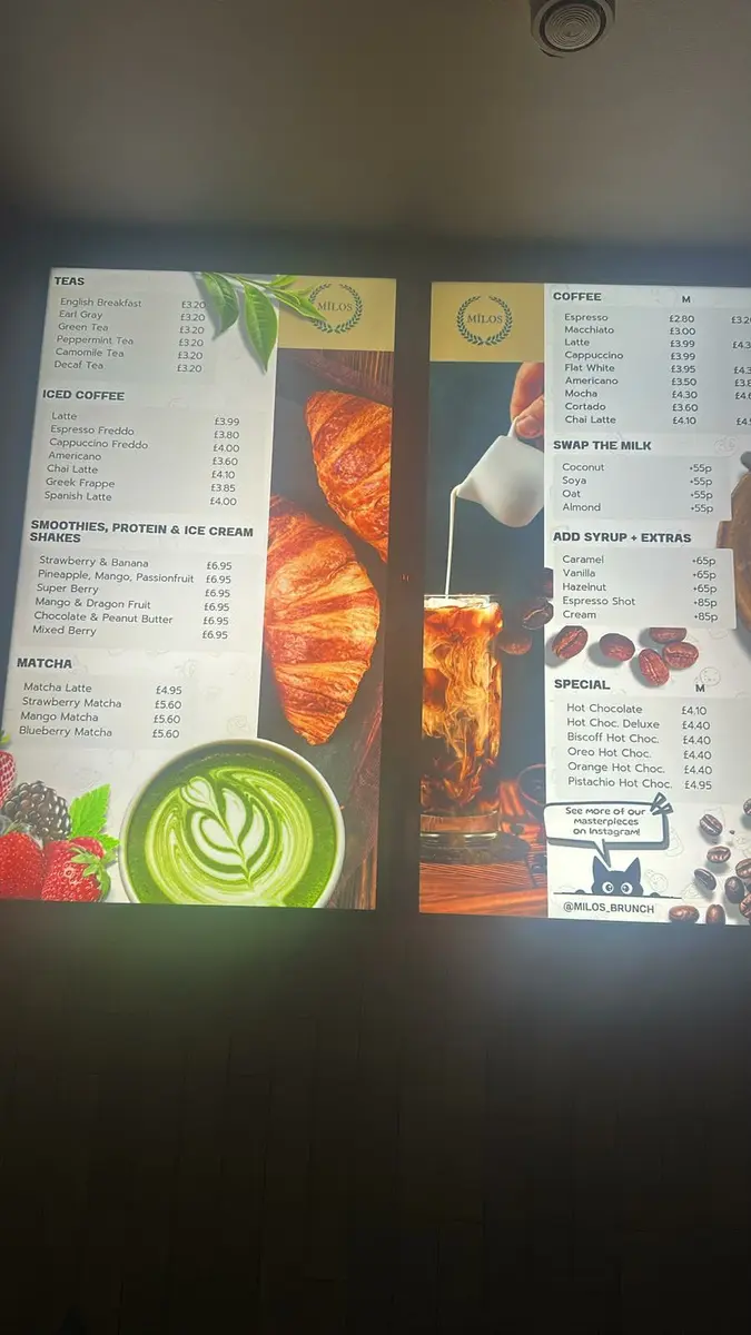 Digital menu display in a UK restaurant showing daily specials.